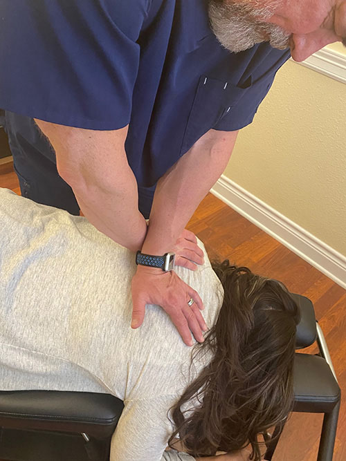 Chiropractor Round Rock TX Marc Richardson Adjusting Patient