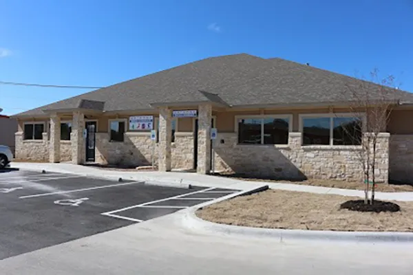 The front of the clinic. It is made of stone.